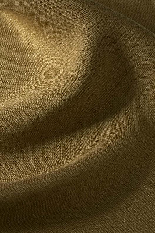 ANITRI – TCD971/R1 Col. 18231 | Twill, Piece Dyed. Effect yarn in monofilament, subtle shimmering/ sparkling texture, malleable drape. Company certifications: ISO9001, ISO45001; Oeko-Tex by Step; ZDHC waste water guidelines. 67% of energy comes from renewable sources, 30% is self-produced via photovoltaic and biomass plants, 54% of process water is recycled.


