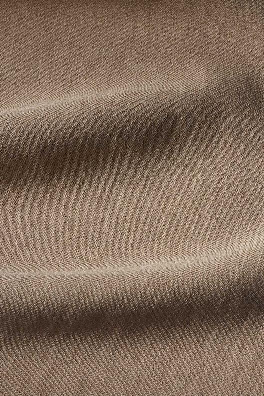 ANIMEL – TCD547/F1 col. 003 | Non Stretch, Twill, Yarn Dyed with natural slubs and neps. Company certifications: ISO9001, ISO45001; Oeko-Tex by Step; ZDHC waste water guidelines.
67% of energy comes from renewable sources, 30% is self-produced via photovoltaic and biomass plants, 54% of process water is recycled.

