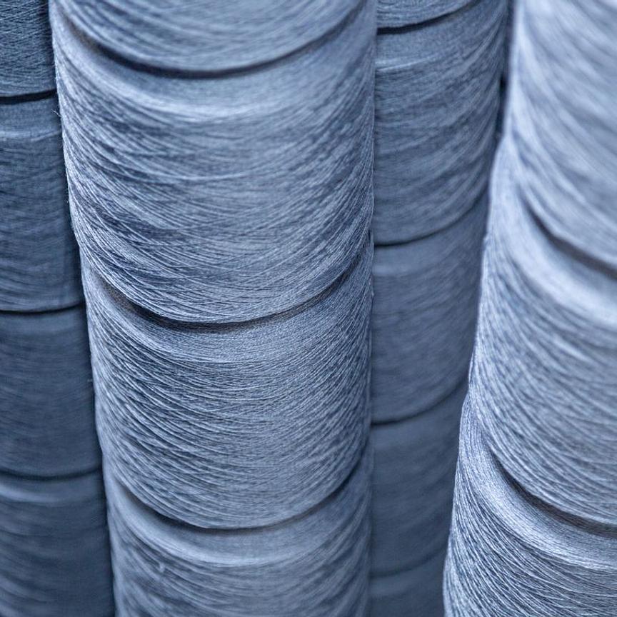 Spools of blue flax-linen thread