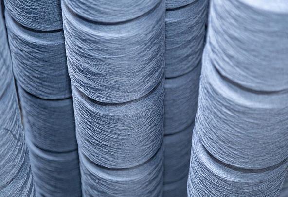 Spools of blue flax-linen thread